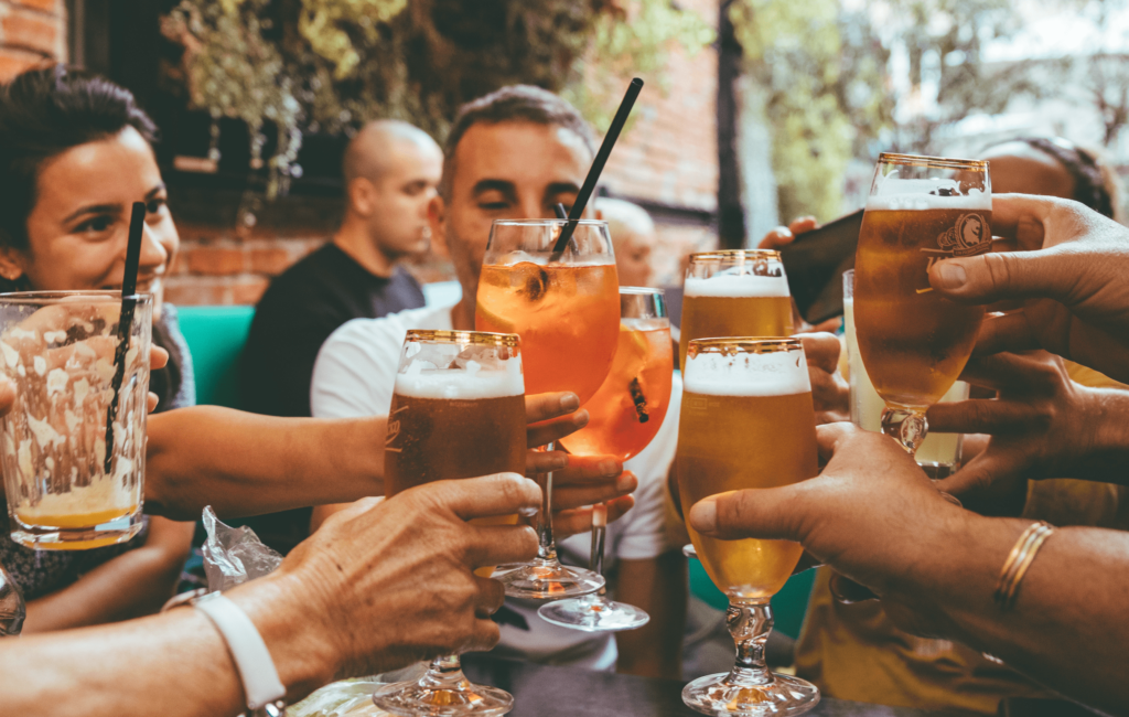 friends toasting with alcohol gray area drinking