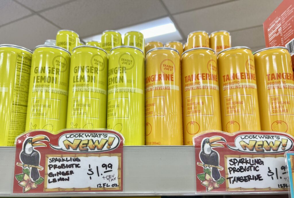 non-alcoholic drinks at trader joe's shelf of sparkling probiotic ginger lemon and tangerine drinks